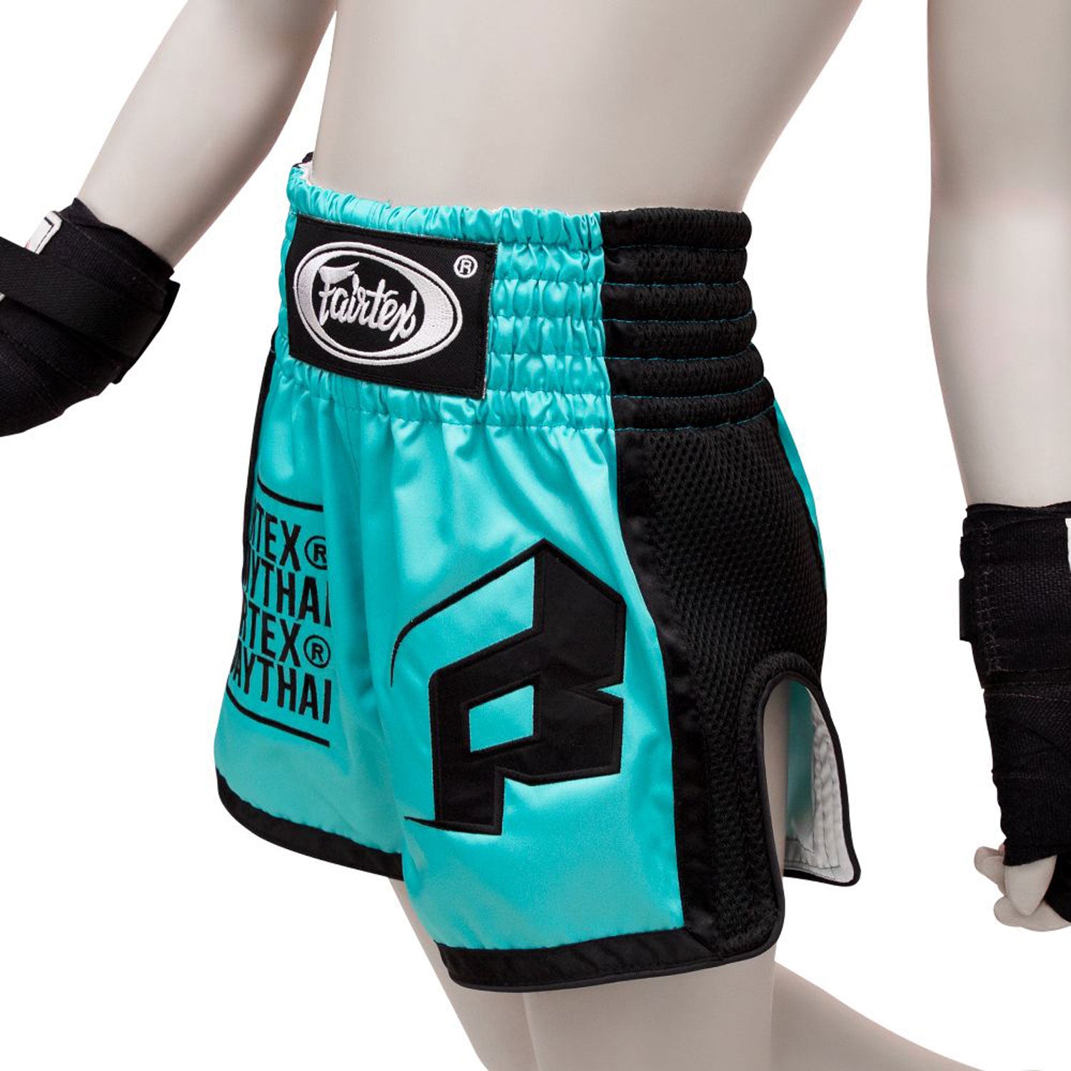 Fairtex kids Muay thai Shorts Turquoise with fairtex text in black and black piping/side panels