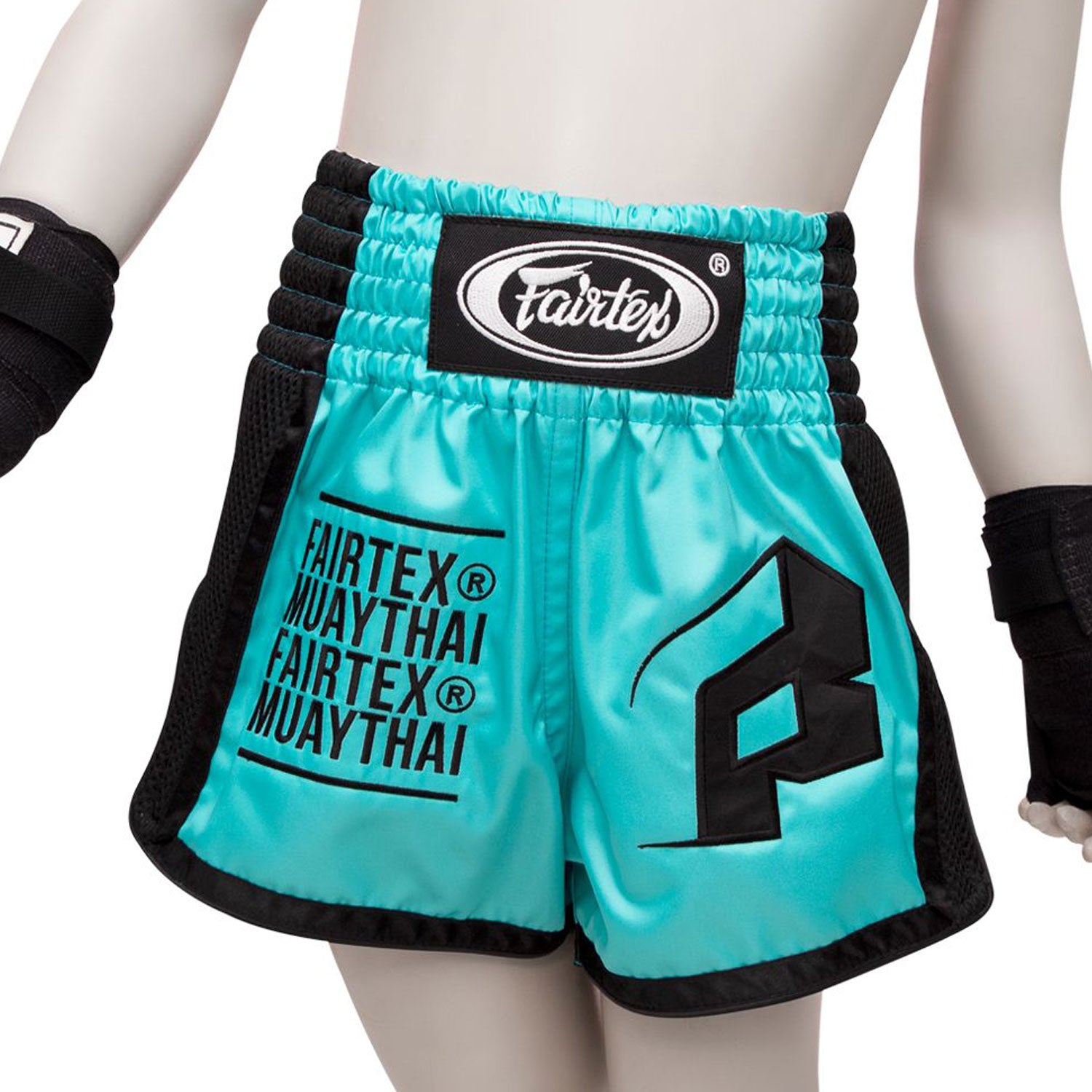 Fairtex kids Muay thai Shorts Turquoise with fairtex text in black and black piping/side panels