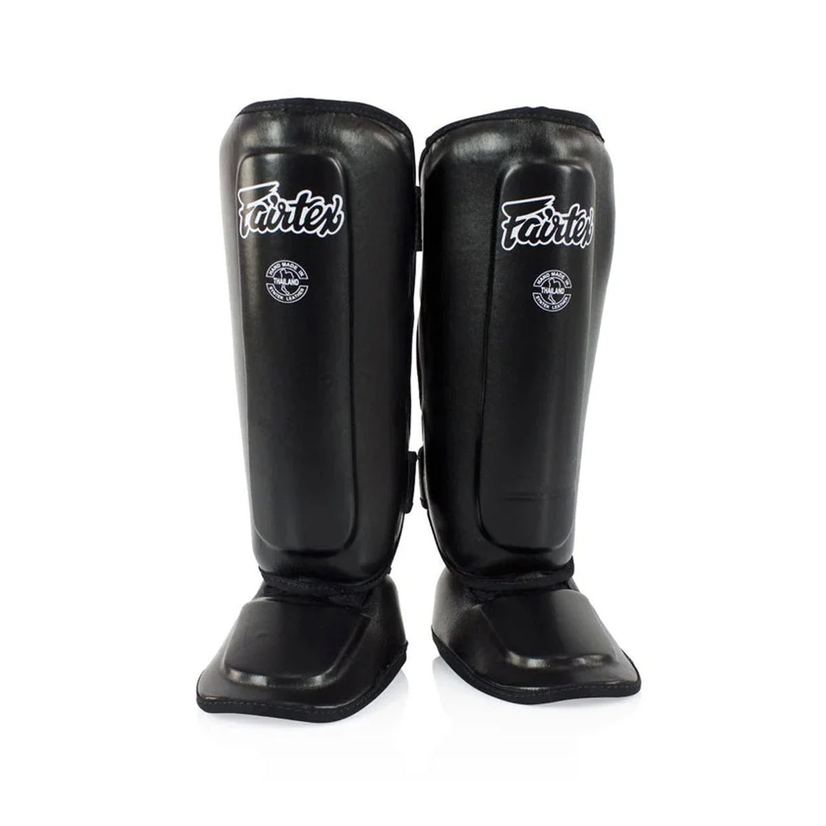 Fairtex SPK9 kids’ shin pads in black, angled front view with white Fairtex logos