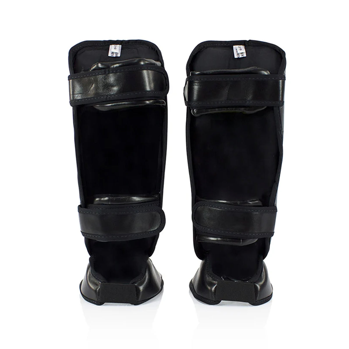 Fairtex SPK9 kids’ shin pads in black, rear view showing two fastening straps on each guard