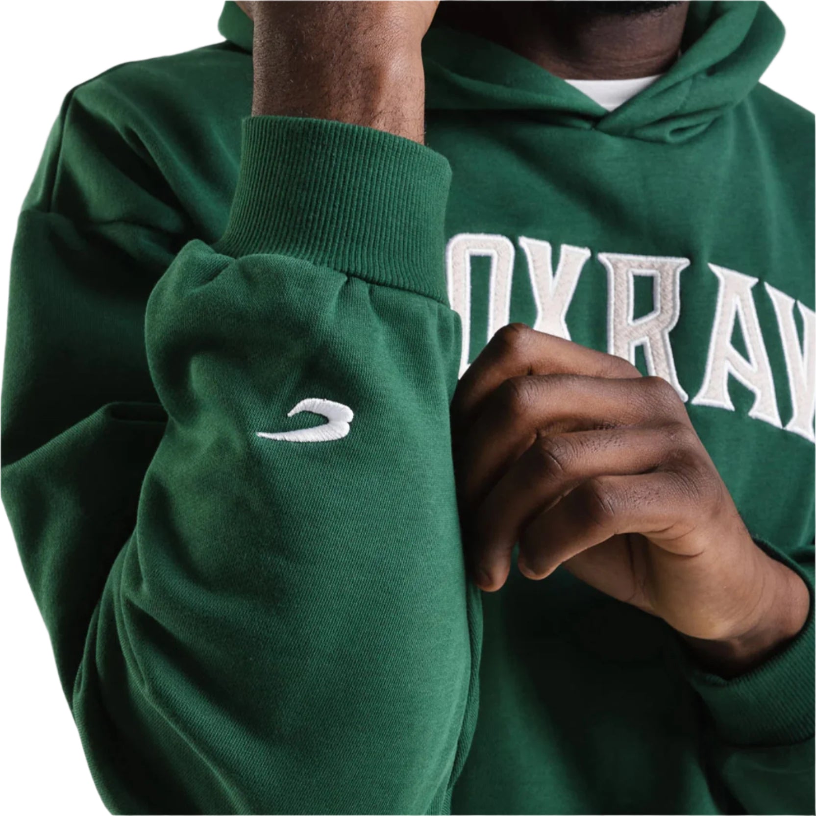 boxraw east street hoodie green with white boxraw logo on front chest image shows close up look at the lower arm of hoodie which displays a white boxraw logo