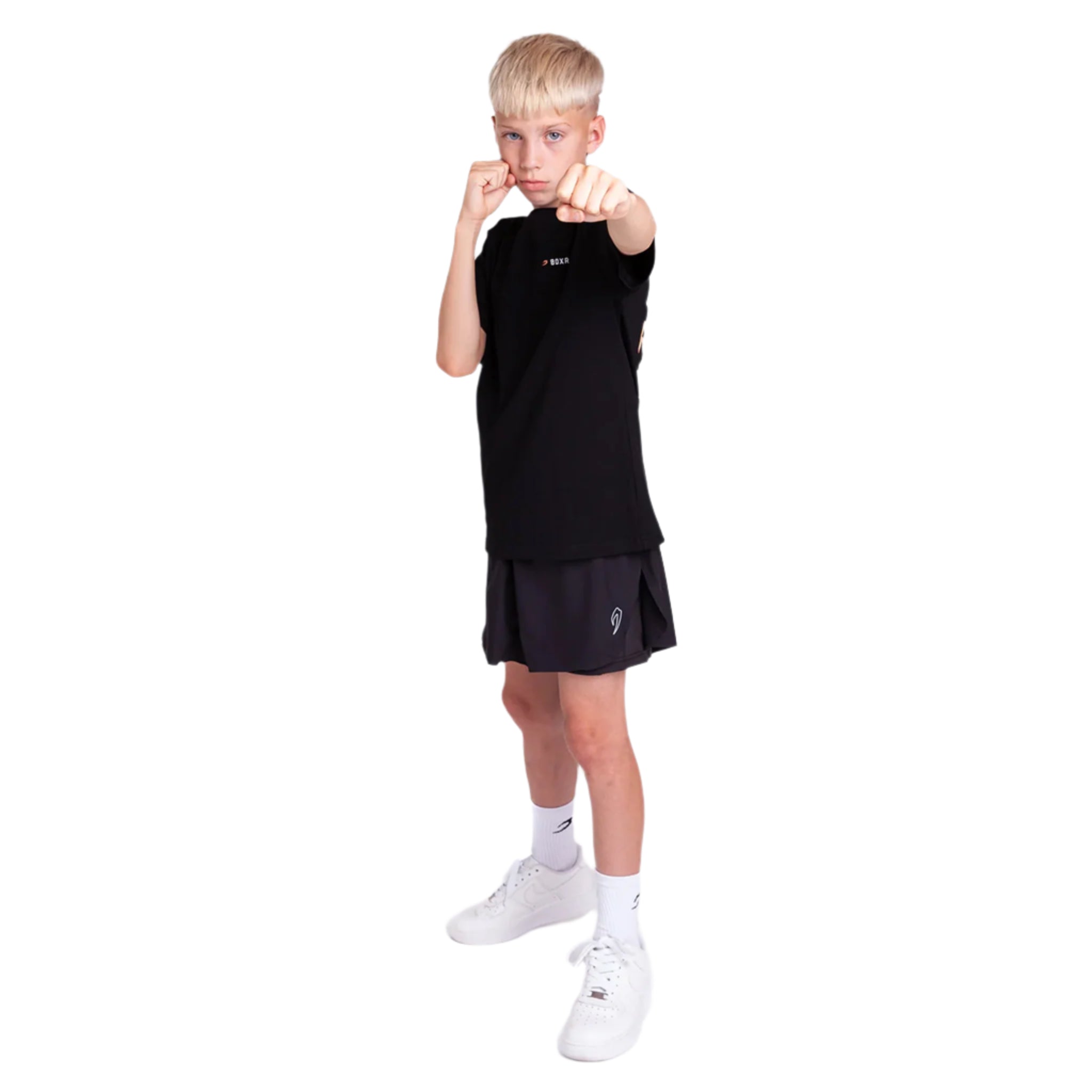 Child wearing a boxraw kids we dont play boxing t-shirt black with black shorts on a white background