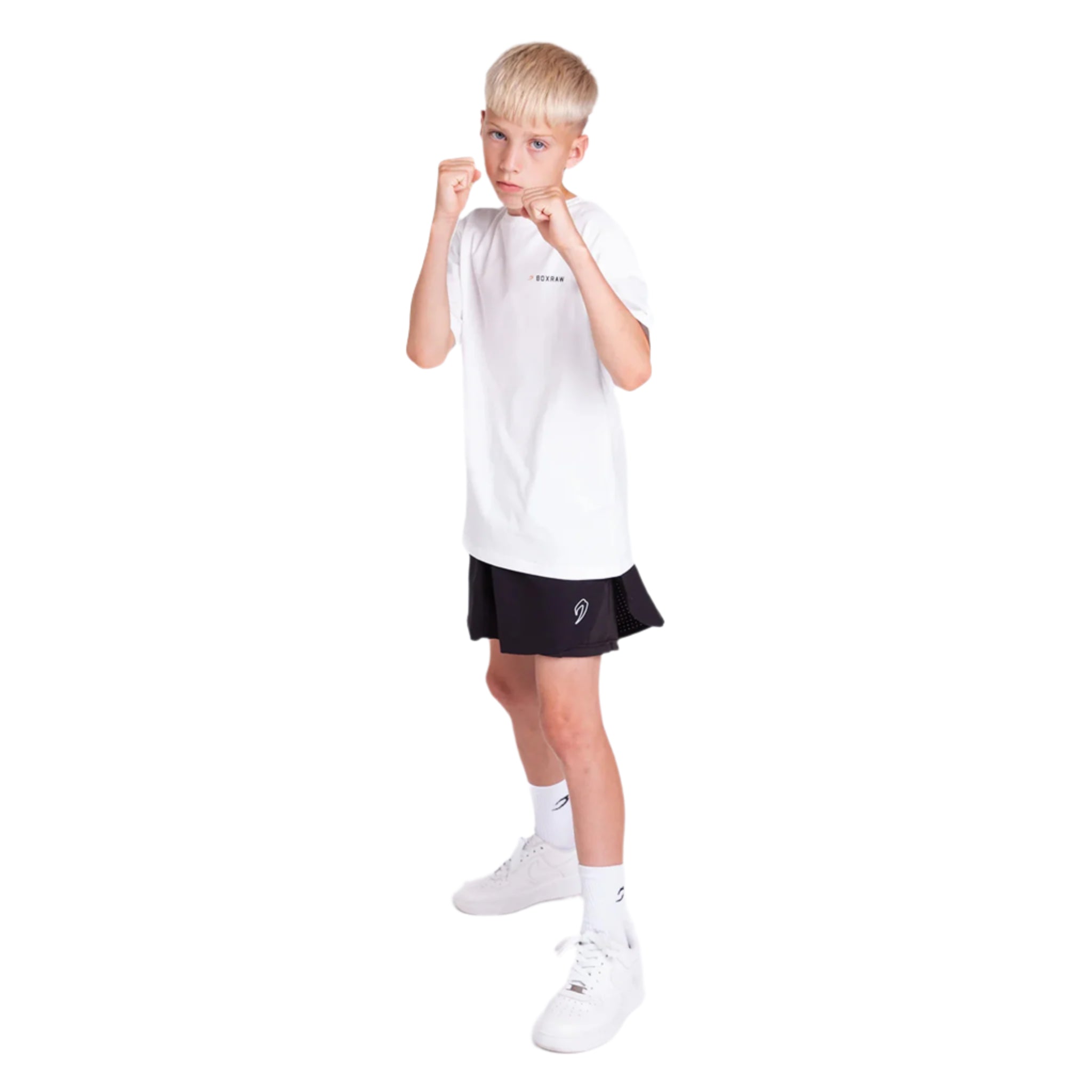 Child wearing a boxraw kids we dont play boxing t-shirt white with black shorts on a white background