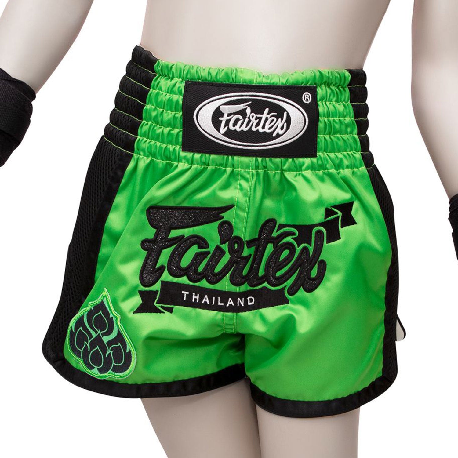 Fairtex Kids Muay Thai Shorts - Siam. Green shorts with black piping and black glitter Fairtex logo and Fairtex logo waistband