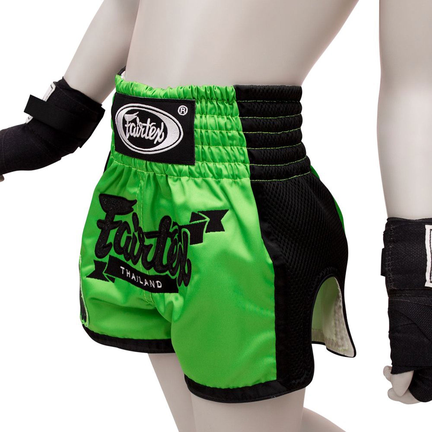 Fairtex Kids Muay Thai Shorts - Siam. Green shorts with black piping and black glitter Fairtex logo and Fairtex logo waistband
