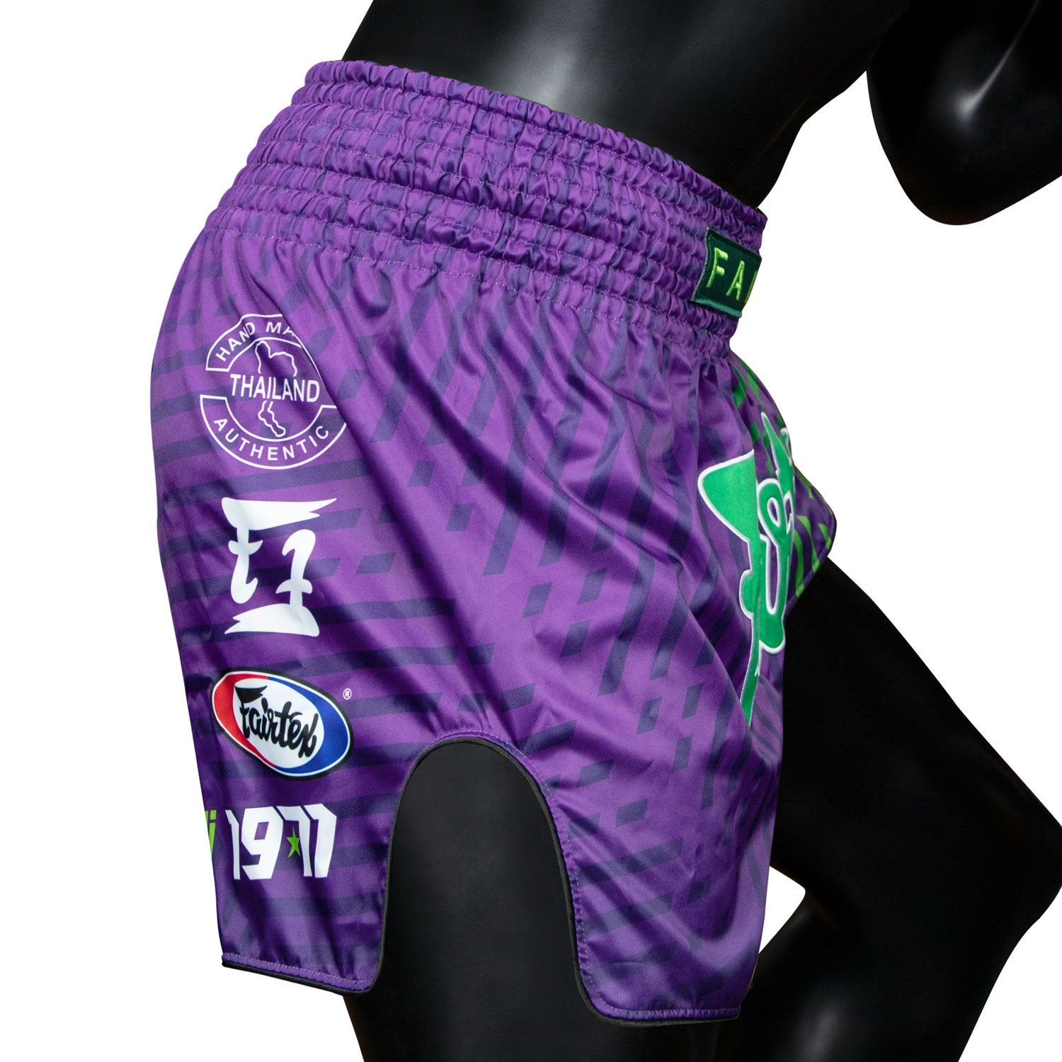 fairtex slim cut racer muay thai shorts purple with green stripes and green Fairtex logo