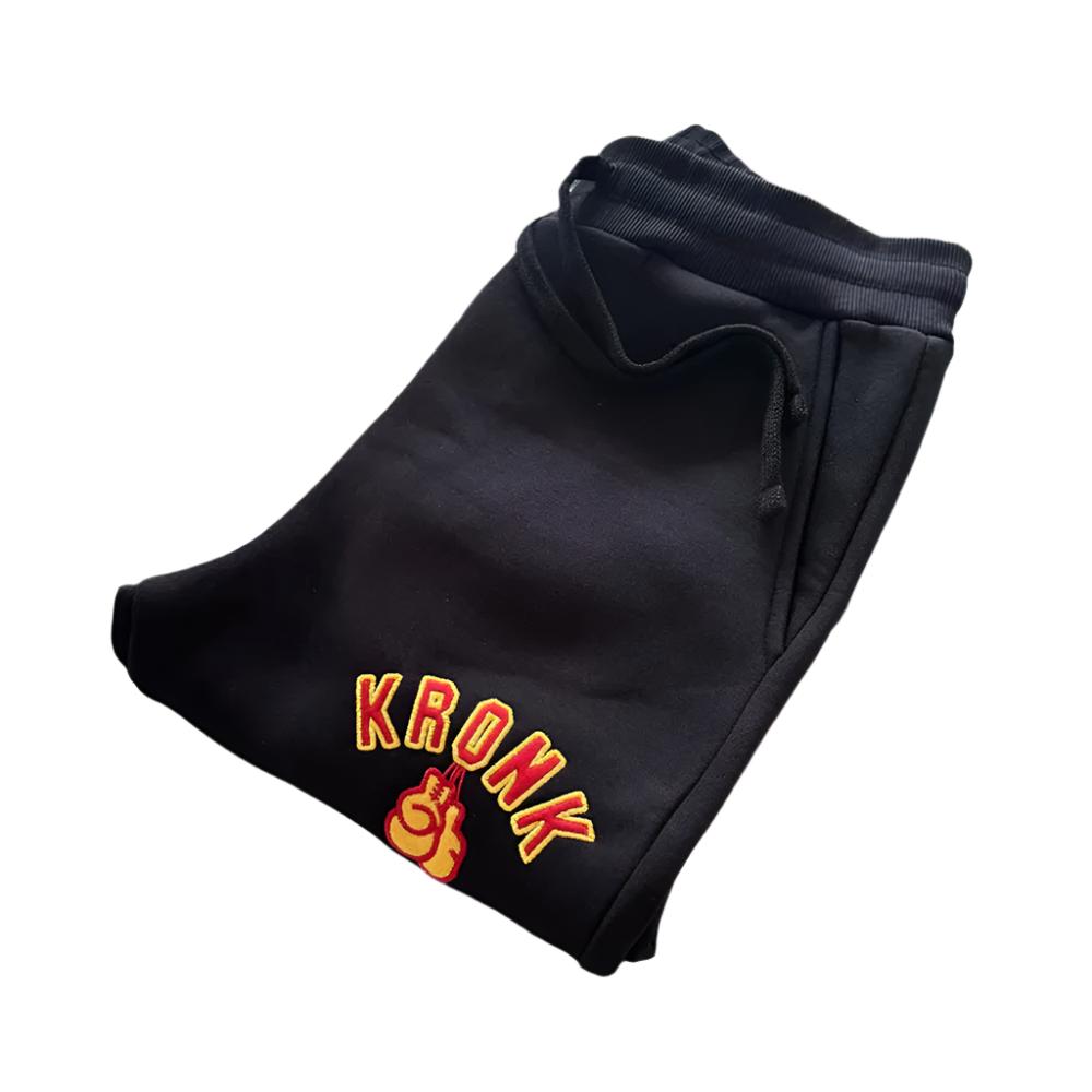 Kronk Gloves Applique Joggers Athletic Fit black with yellow and red kronk boxing gloves design on left leg folded up